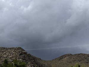 Storm Clouds Over Desert Hills
