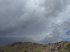 Storm Clouds Over Desert Hills